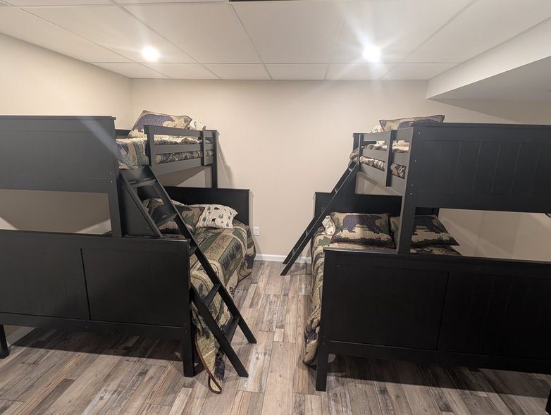 Lower-level bunk room with two twin-over-full bunk beds