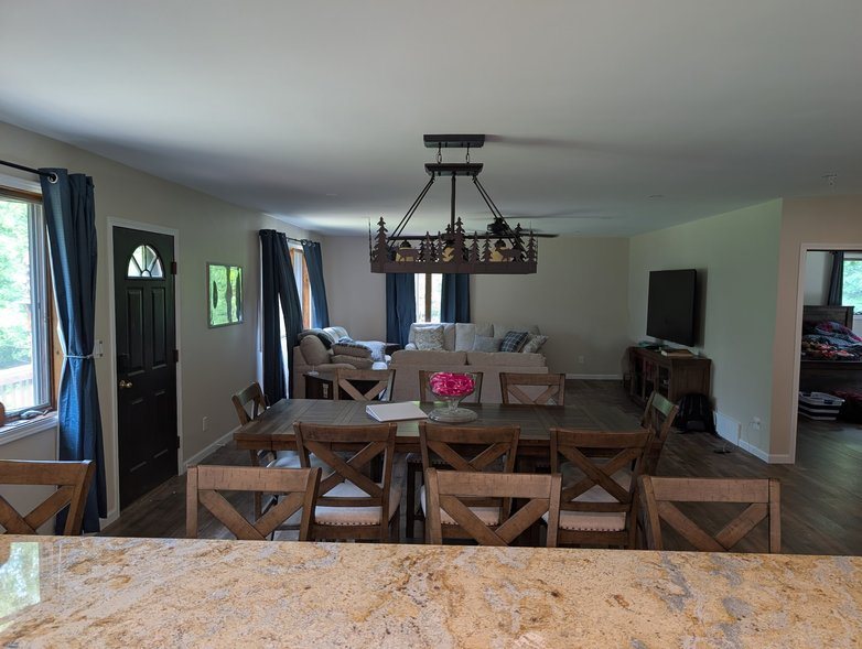 View from the kitchen counter across the dining and living area