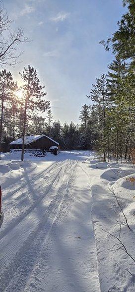 Snowy trail leading to the cabin