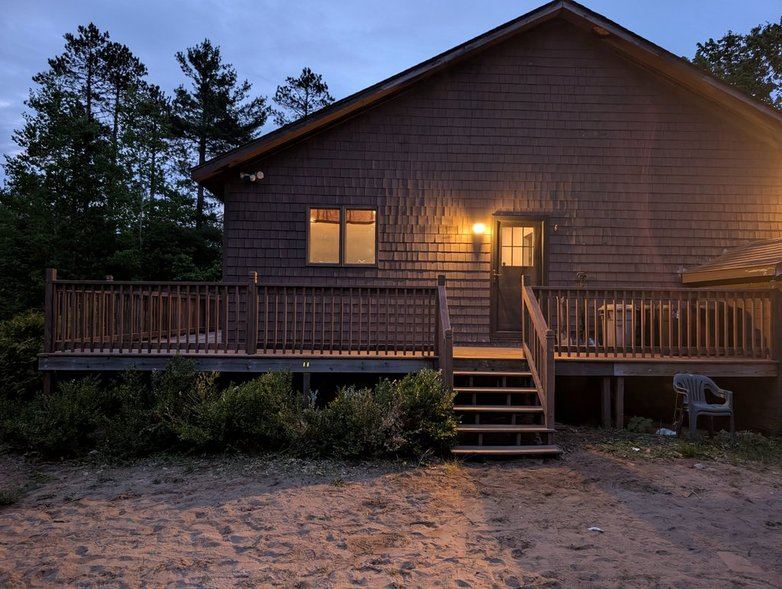 Back deck with a warm light at dusk